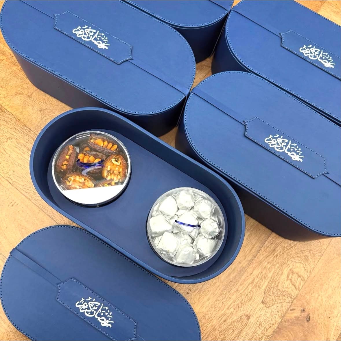 Blue presentation boxes with treats